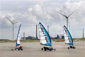 Beach sailing, with wind turbines and Tata Steel plant in the background