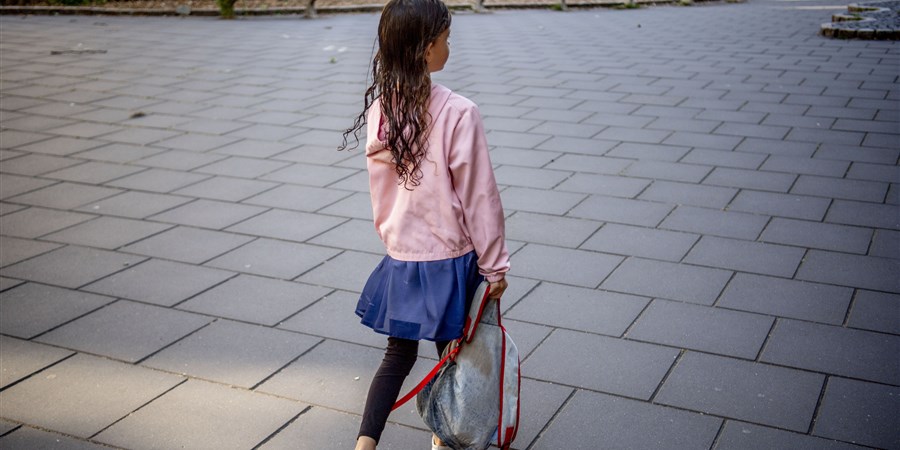 Girl carrying backpack