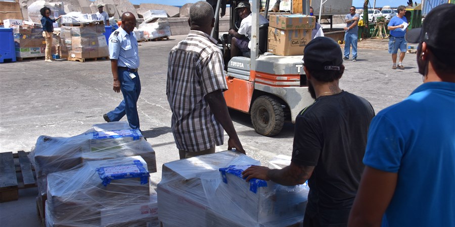 Men loading and unloading goods