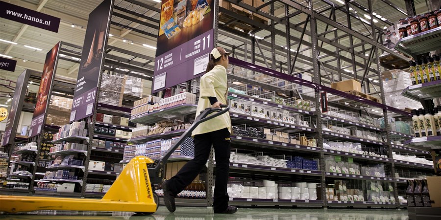 Employee pulling a hand pallet truck