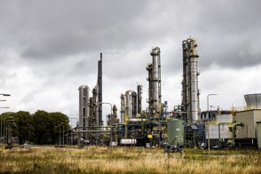 The Heerlen office of Statistics Netherlands, with a sign in the foreground displaying its logo and the full Dutch name in text: Centraal Bureau voor de Statistiek.