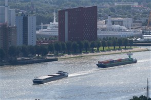 Inland vessel sailing through Rotterdam