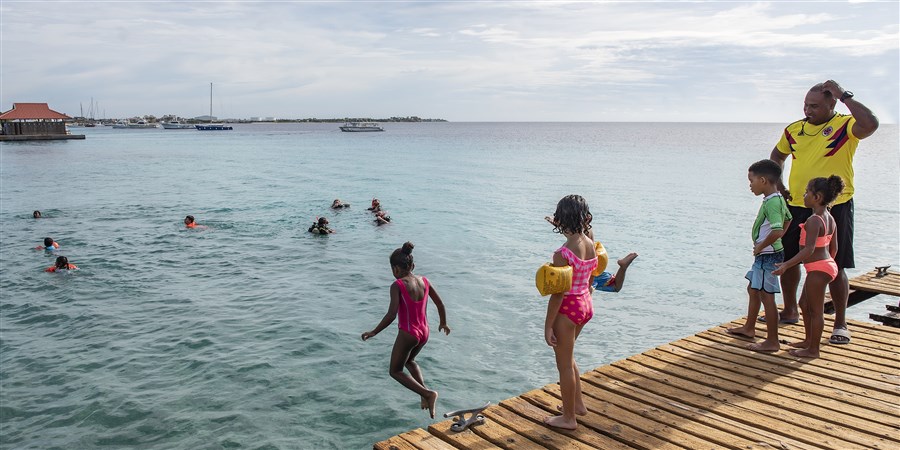 Children on Bonaire get swimming lessons in open water