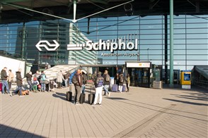 Travellers at Schiphol Airport.