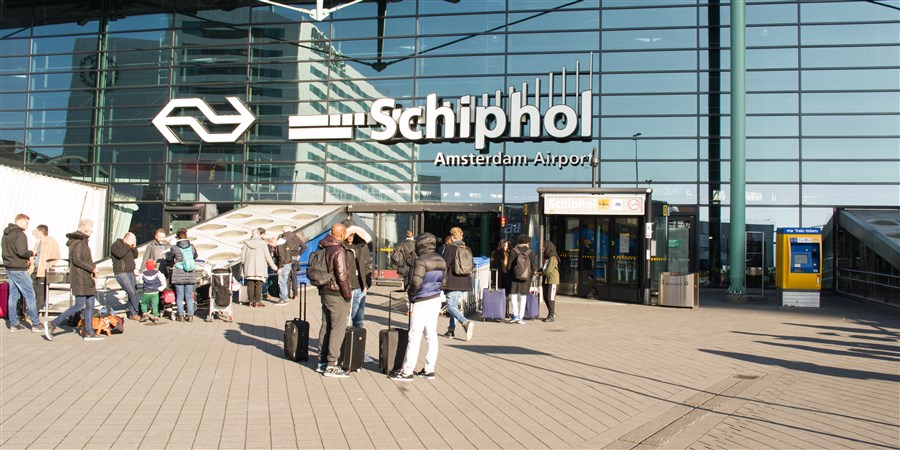 Travellers at Schiphol Airport.