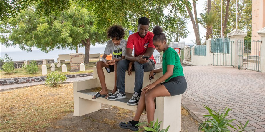 Kids sitting on a bench