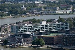 The Heerlen office of Statistics Netherlands, with a sign in the foreground displaying its logo and the full Dutch name in text: Centraal Bureau voor de Statistiek.