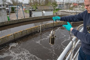 Worker at a sewage treatment plant