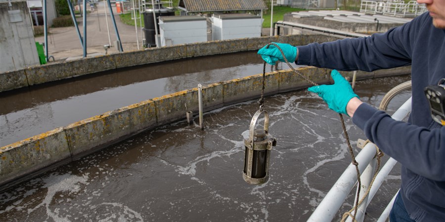 Worker at a sewage treatment plant