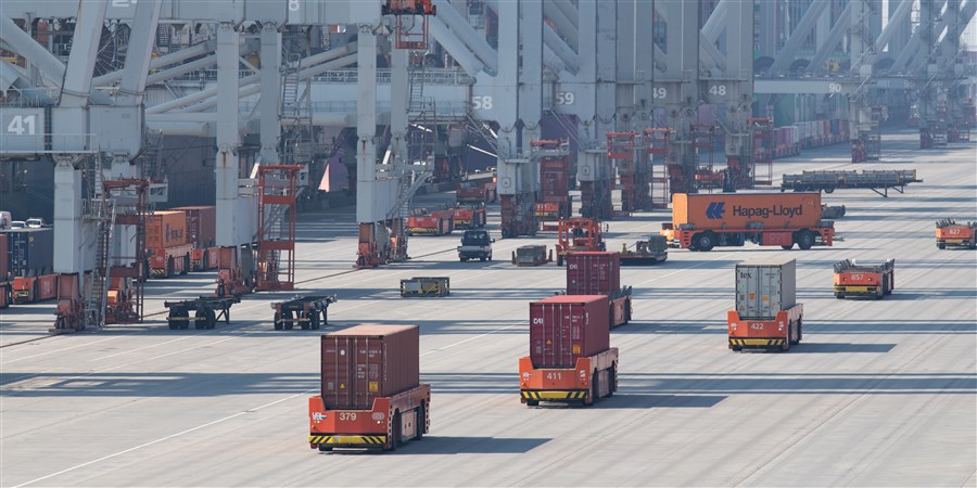 Goods containers being handled in a port area