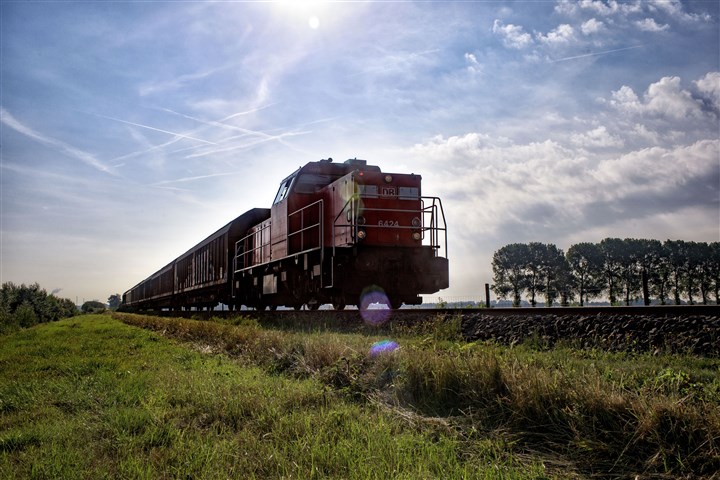 Railway locomotive, riding through nature.