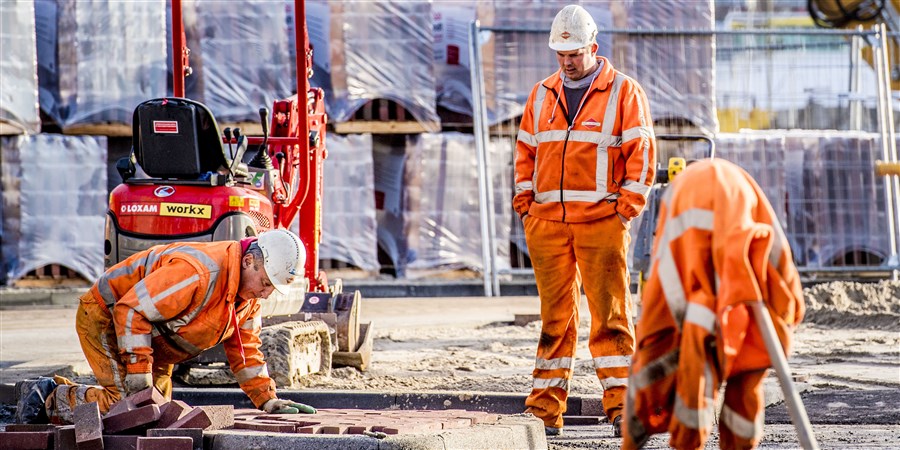 Construction workers working on a street